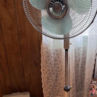Oscillating Fan On Tall Stand And A Small Box Fan