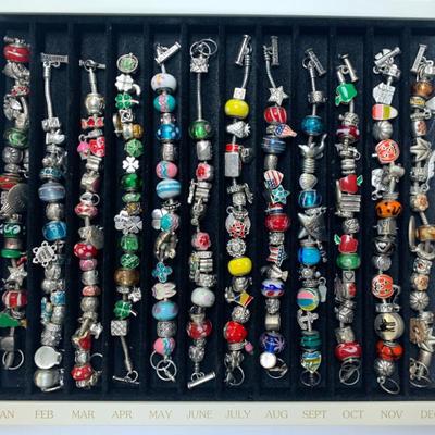 Sale Photo Thumbnail #56: Willabee and Ward 12 month charm bracelets in case.
