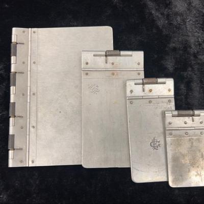 Four vintage early 1900s aluminum clipboards