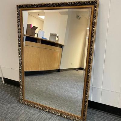 Large gold toned wood framed mirror