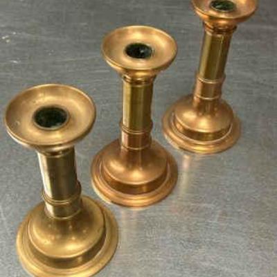 Three solid brass candlestick holders