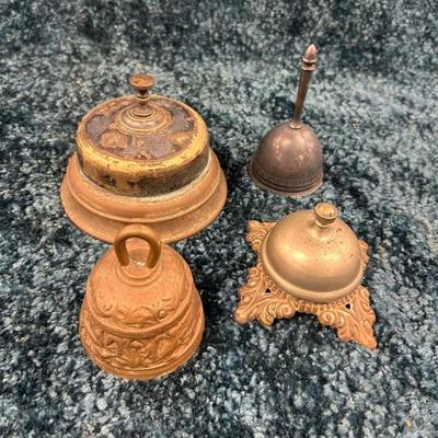 Four vinatge brass bells