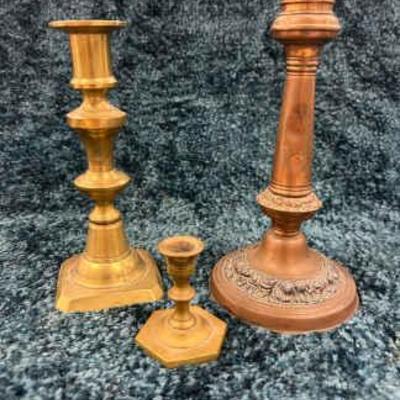 Three brass candlestick holders