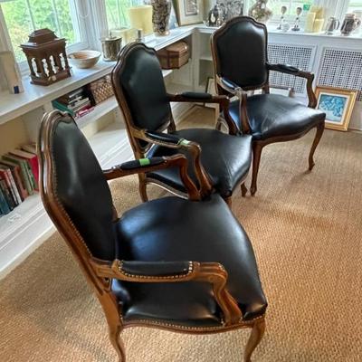 Three leather occasional chairs