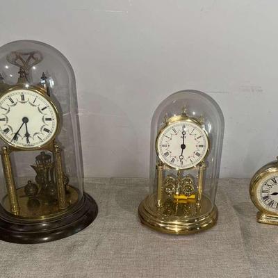 Collectible Clocks And An Avon Perfume Bottle