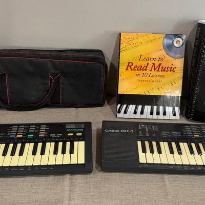Casio Sk-1 Keyboards (2), And Music Books (2)