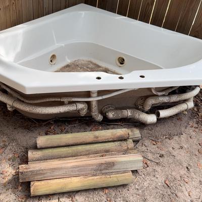 Corner Bathtub Or Flower Bed And Wood