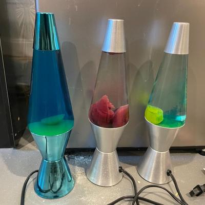 Three Lava Lamps Including A Metallic Teal Base