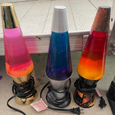Three Lava Lamps Including One With A Metallic Gold Base