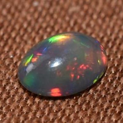 1.3 Carat Oval Black Opal Cabochon - AAA