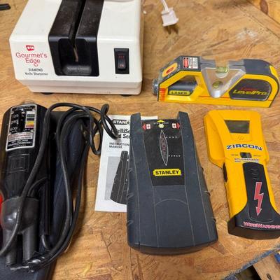 Wigginton Voltage Tester, 2 Stud Finders, Level, And Knife Sharpener