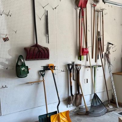 A Large Lot Of Tools Including, Shovels, Rakes, And Brooms