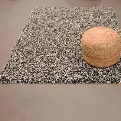 Multicolored Rug and Woven Ottoman 