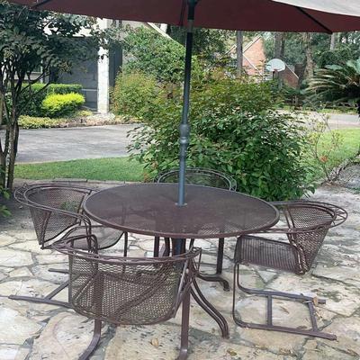 Table, Four Chairs, And Umbrella 