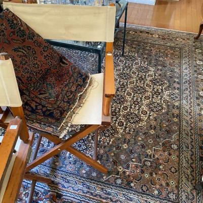 large assortment of area rugs throughout home