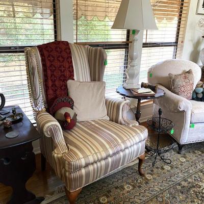 assortment of cream colored chairs from wing back to overstuffed