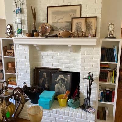 fireplace area full of vintage antique and one of kind items