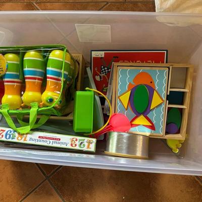Group Of Early Childhood Learning Games And Toys In Tote