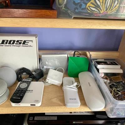 Smart speaker, Bose portable CD player, Apple Trackpad, external battery packs