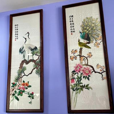 Two of four framed painted silks