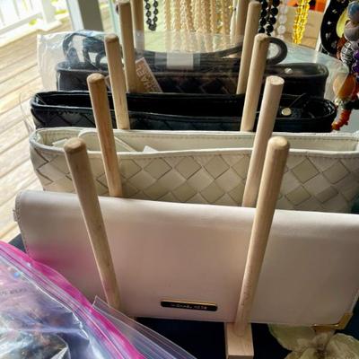 Michael Kors leather clutches, most of which are new
