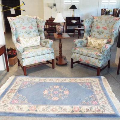 PAIR OF CHINTZ UPHOLSTERED WINF BACK CHAIRS WITH CHINESE CARVED RUG AND HIGH END CIGARETTE TABLE