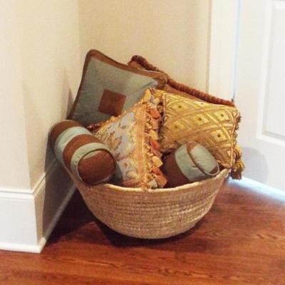 BASKET FILLED WITH PILLOWS