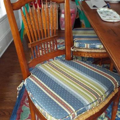 HANDMADE TABLE WITH 2 LEAVES, 4 SPINDEL BACK CHAIRS, ONE FIDDLE BACK CHAIR AND TWO RED LADDERBACK CHAIRS