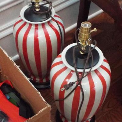 RED AND WHITE STRIPED LAMPS AND THERE ARE LAMPSHADES