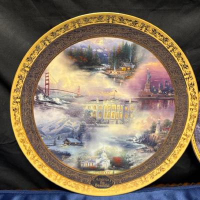 Lot 521: Thomas Kinkade Collector Plates – America the Beautiful & Lights of Liberty