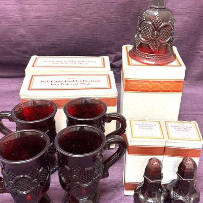 Lot 137:  Vintage Avon 1876 Cape Cod Ruby Red Glass Collection – Mugs, Bell & Salt/Pepper Shakers wi