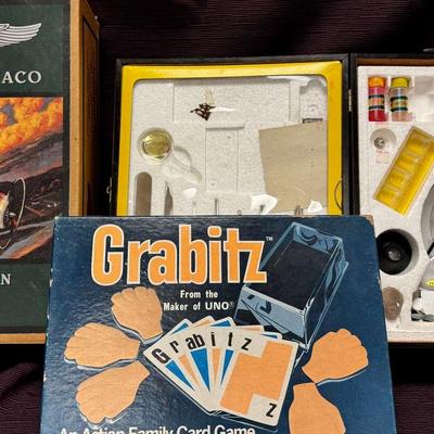Lot 102:  1931 Stearman Biplane, Microscope, Grabitz Game From The Maker Of Uno
