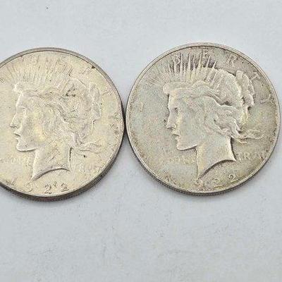 1308 • (2) 1922 silver peace dollars