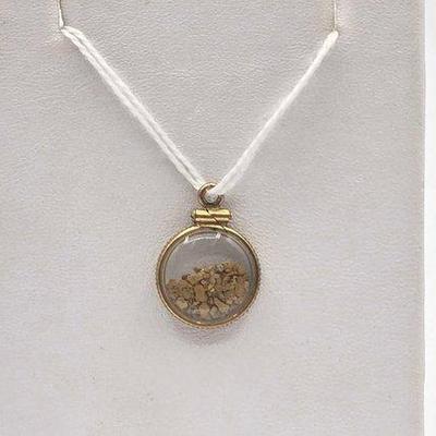 882 • pendant filled with gold flakes