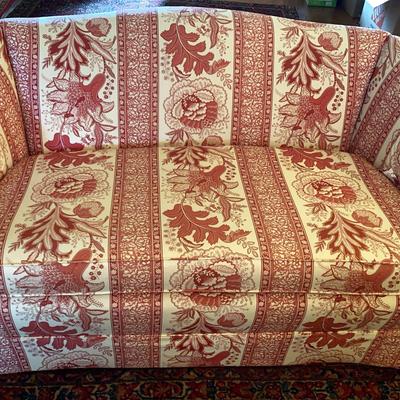 Red and White Upholstered Loveseat