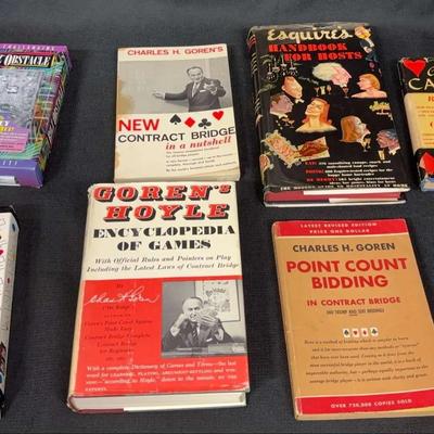 Four Gaming Rule Books, Bidding Wheel, Handbooks for Hosts, and Two Bilz Boxes