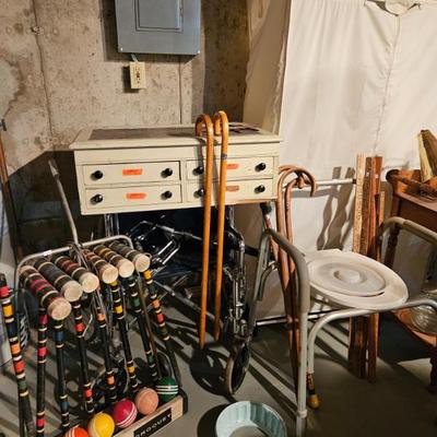 Canes, croquet set, and apothecary desk