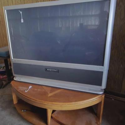 Older big screen TV and Modern corner table