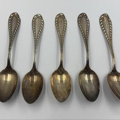 Seven Ornate Antique Sterling Serving Spoons