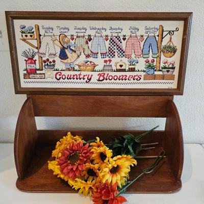 Lot #85 - Cross Stitch Art "Country Bloomers" & "Dance Like No-one is Watching" With Wood Shelf & Faux Flowers