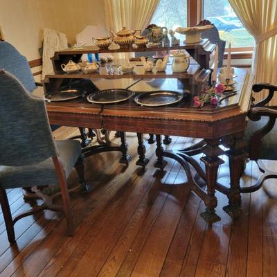 Sale Photo Thumbnail #3: Expanding dining table with 3 leaves, includes 6 side chairs and 2 Arm Chairs.
