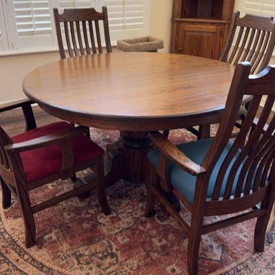 53 1/2 Inch Round Oak Kitchen Table With Four Cushioned Oak Chairs