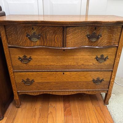 Antique Oak Serpentine Front 4-Drawer Dresser with Brass Pulls
