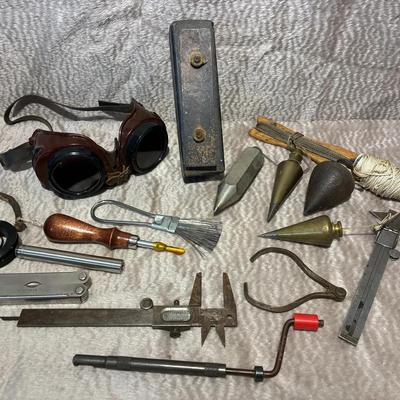 Brass plumb bobs and other tool bench oddities