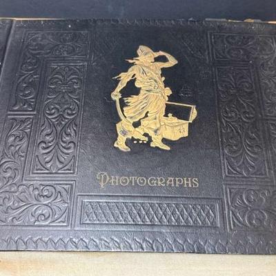 Vintage photo album with movie stills family photos