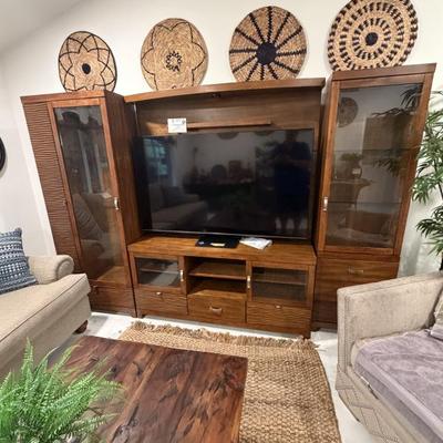 Very unique entertainment center holds up to a 70 inch TV