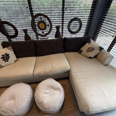 Unique off-white sofa with a built-in storage unit—like having a sofa table perfectly integrated