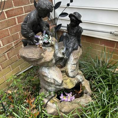 Waterfall - Boy And Girl On Rocky Cliff
