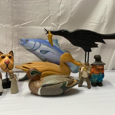 Hand Carved Wooden Decor Some Whimsical Some Thoughtful. Each May Make a Person Feel Happy