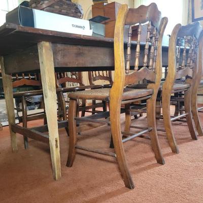 Sale Photo Thumbnail #88: French farm style table with solid wood rush chairs. Table is 37" wide X 84" Long. $155 for all of it. 6 chairs.